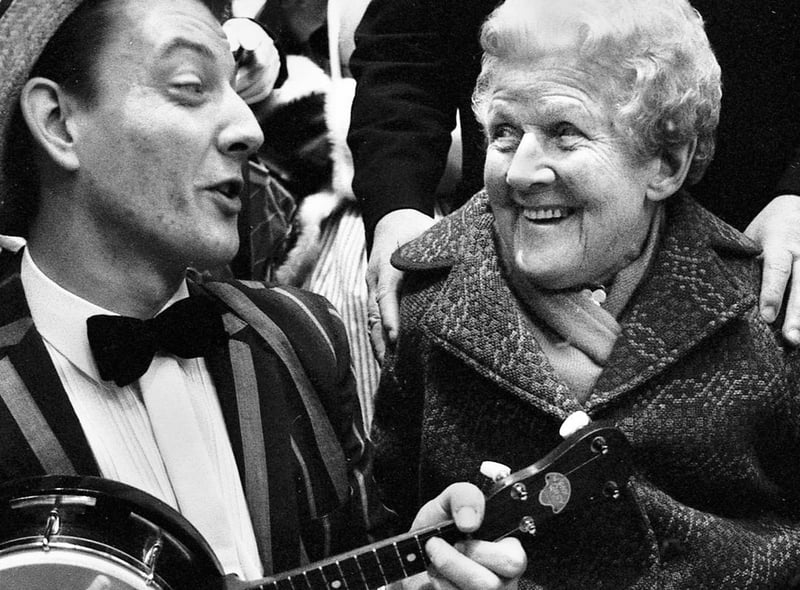 George Formby Society member Mick Metcalfe serenades 90 year old Nellie Seddon after the official opening ceremony of the new market hall.