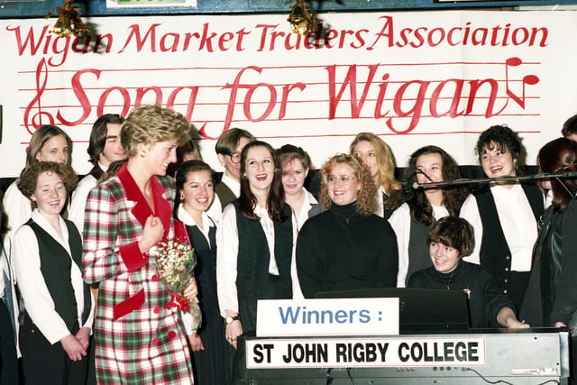 Princess Diana on a happy note with St. John Rigby College students who were winners of a "Wigan Market Traders Association - Song for Wigan" competition during her visit to open the Galleries, Courthouse and new Town Hall on Monday 25th of November 1991.