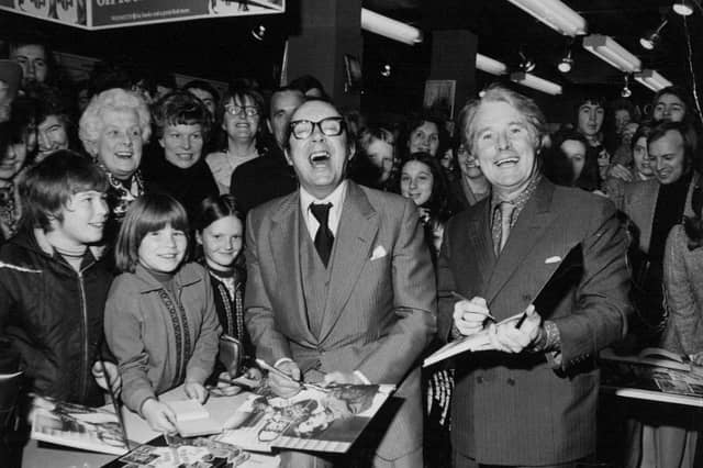 Eric Morecambe and Ernie Wise are all smiles during a visit to the city centre in October 1974.