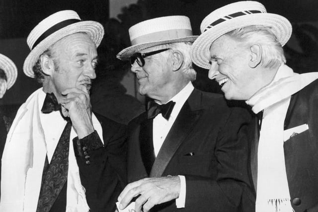 David Niven, Cary Grant and Douglas Fairbanks Junior share a joke during a Roaring Twenties ball held at the Queens Hotel in October 1974.