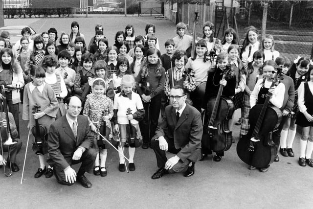 Members of the East Leeds Youth Orchestra in March 1974 with recorder grouop conductor Michael Landa (left) and orchestra conductor Mr. J. Renhard.