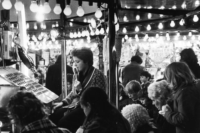 'Eyes down' for a full house at one of the bingo stalls at the Queens Hall which was staging its annual post Christmas fair in December 1974.