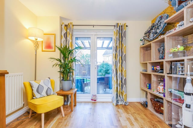 Through the lounge is an additional living space. It is currently used as a playroom but could also be used as an office. Double patio doors lead out into the garden.