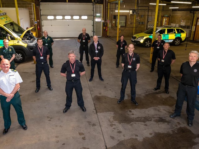 Supporting firefighters with Police, Fire and Crime Commissioner Stephen Mold (centre), Chief Fire Officer Darren Dovey (far right, at the back in front of ambulance vehicle), Group Manager Stefan Douglas (front right) and Michael Jones, General Manager for Northamptonshire at East Midlands Ambulance Service