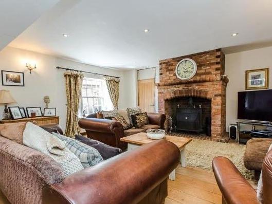 Despite its size, the home has a warm and cosy sitting room