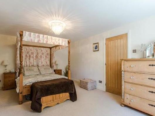 This room is big enough for its own four-poster bed