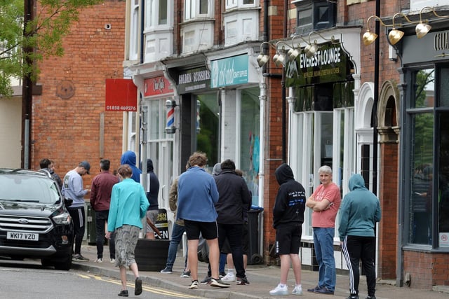 Busy scenes outside Golden Scissors on St Mary's Road.