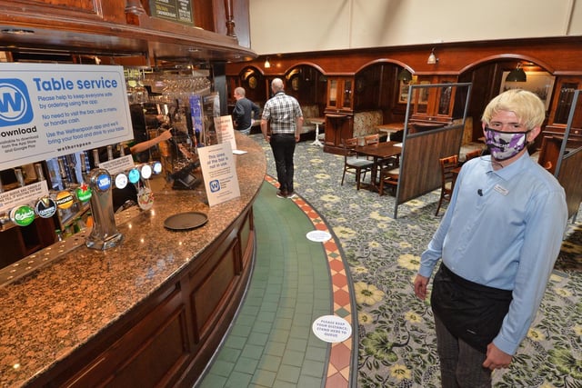 Open for business...Aaron Fraser shift manager inside the Sugar Loaf in Market Harborough.