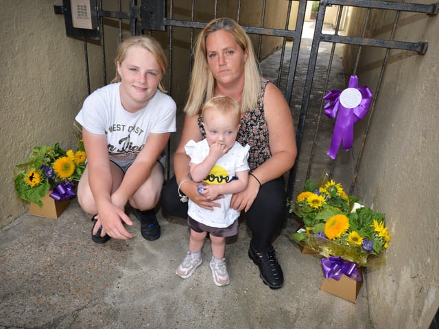Flowers in memory of Kayleigh Hanks at the gates to her old flat in London Road, Bexhill. SUS-200721-130837001