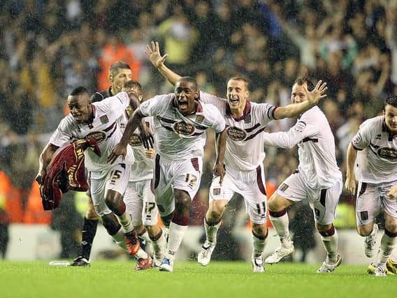 LIVERPOOL STUNNED: Cobblers celebrate their shoot-out success at Anfield in 2010. Pictures: Pete Norton