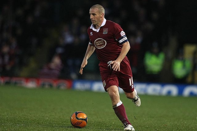 The defender was into his fourth of six seasons at the Cobblers when he captained Cobblers to victory at Anfield. Retired in 2013 after a year at Corby Town and moved back to Manchester where he's done some coaching.