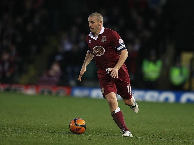 The defender was into his fourth of six seasons at the Cobblers when he captained Cobblers to victory at Anfield. Retired in 2013 after a year at Corby Town and moved back to Manchester where he's done some coaching.