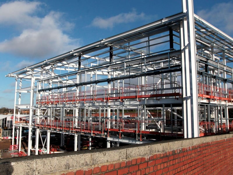 The 1960s station is dwarfed by the new structure being built on the former station forecourt.