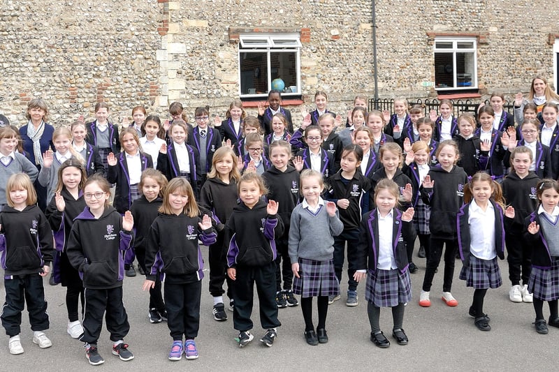 Shoreham College pupils returned to school on International Women's Day, which they marked in the playground.