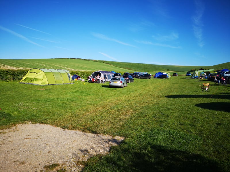 A back to basic, traditional camping experience on a working farm in the heart of the south downs, 25 pitches, no electric hookup, modern facilities. Three camping pods available to rent for a luxury experience.