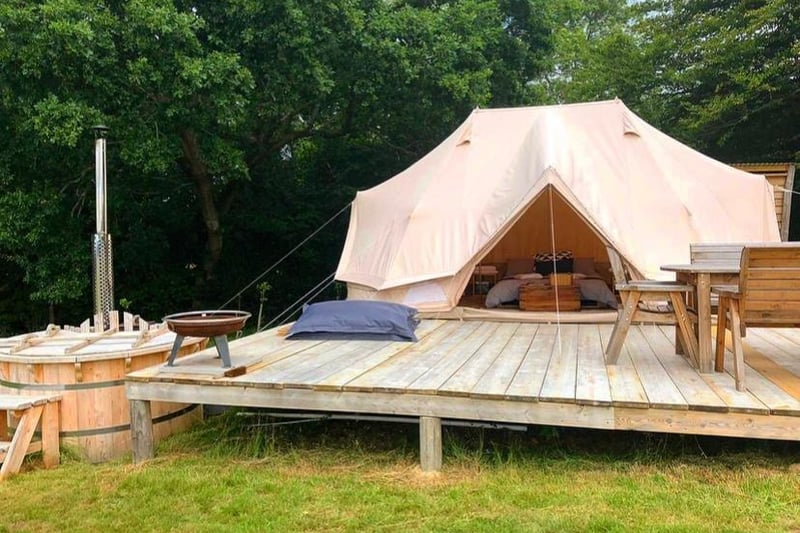 A unique eco-camping experience in emperor tents that sleep four adults/family of six. Each tent has a camp stove, electrical points, private kitchen and bathroom, wood fired hot tub and private decking area.