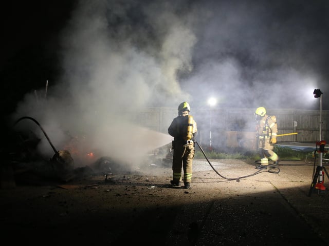 Firefighters wearing breathing apparatus used two high pressure hose reels to bring the building fire under control.