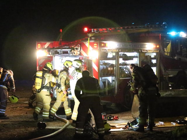 Firefighters wearing breathing apparatus used two high pressure hose reels to bring the building fire under control.