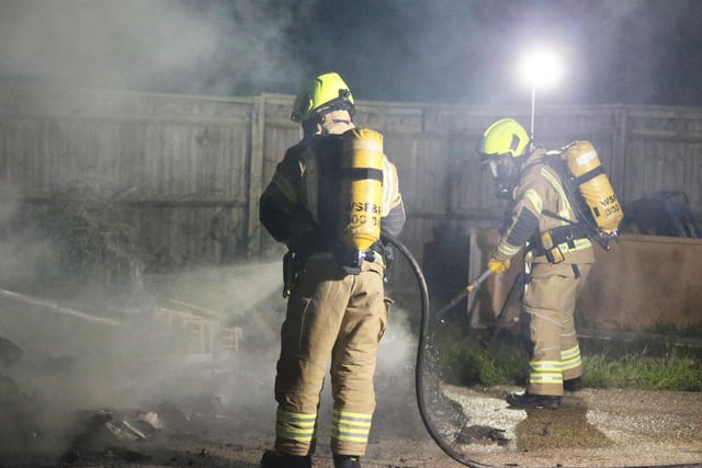 Firefighters wearing breathing apparatus used two high pressure hose reels to bring the building fire under control.