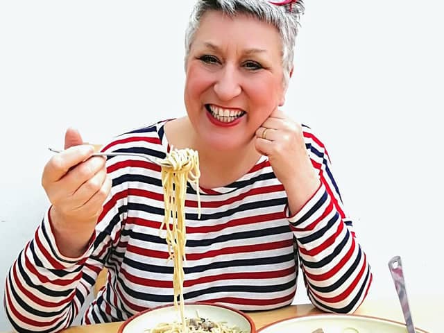 Karen enjoys her delicious mushroom stroganoff