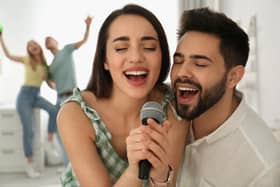 Couple singing romantic ballads on the Karaoke