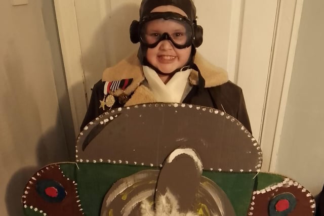 Kyran, 10, dressed as Grandpa's Great Escape in his home-made plane.