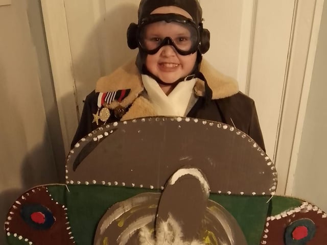 Kyran, 10, dressed as Grandpa's Great Escape in his home-made plane.