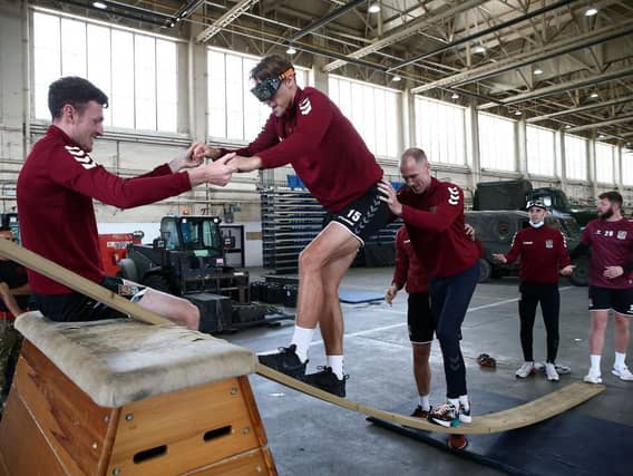Sid Nelson is helped up during one exercise. Pictures: Pete Norton.