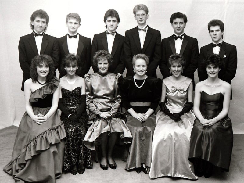 Seated, from left, are Joanne McConnell, Amanda Dobbins, Sarah Ryder, Mary Burke, Marie McElhinney and Lucy Montgomery. Standing are Stephen Quigley, Martin Hegarty, Andrew Keenan, Gary Parke, Stephen McLaughlin and Darren Greer.