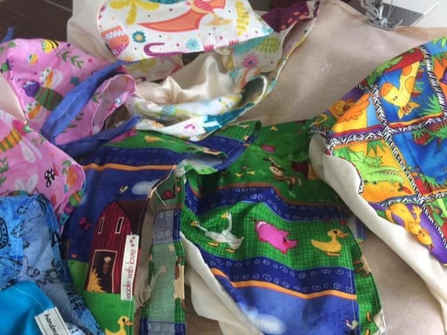 Maureen Molloy: "Sewing away at scrub caps".