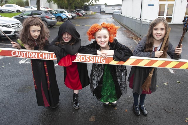 Primary 5s Maeve, Aisling, Cara and Anna get ready to parade for Halloween at Hollybush on Wednesday morning.
