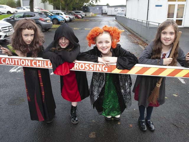 Primary 5s Maeve, Aisling, Cara and Anna get ready to parade for Halloween at Hollybush on Wednesday morning.