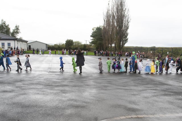 The younger pupils at Hollybush PS parading their Halloween costumes on Wednesday morning last.
