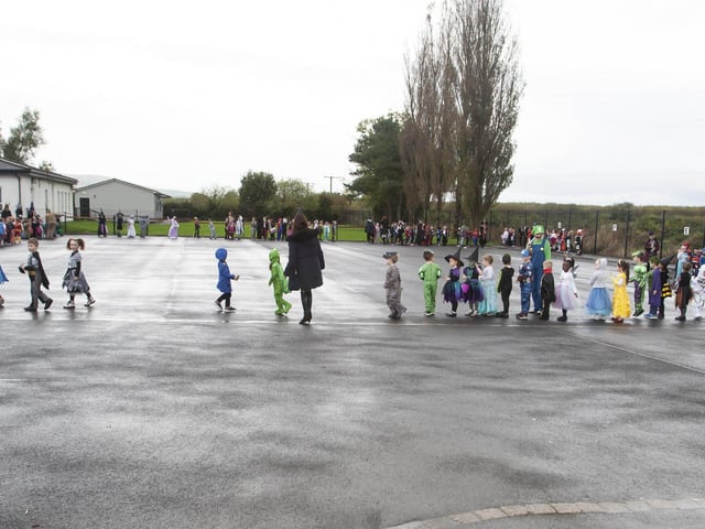 The younger pupils at Hollybush PS parading their Halloween costumes on Wednesday morning last.