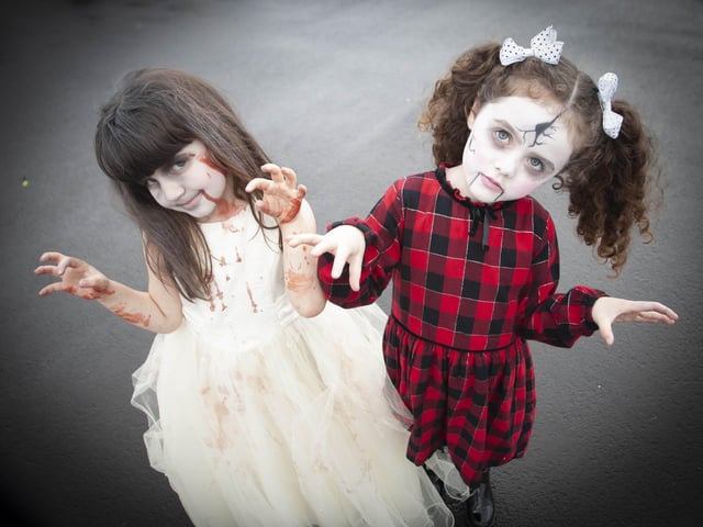 Hollybush PS Zombies Rose Walker and Aliya Rose McLaughlin scare our cameraman on Wednesday. (Photos: JIm McCafferty Photography)