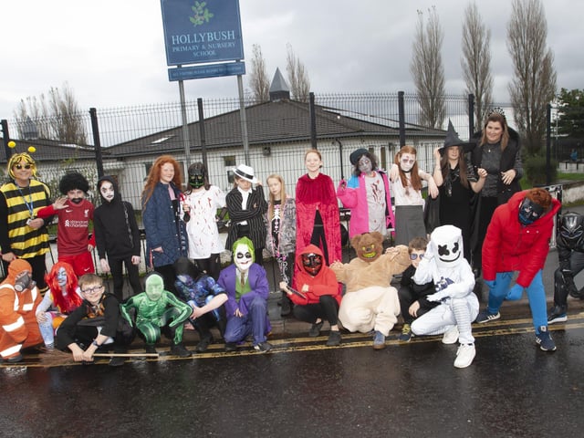 Mrs. McNulty with her P7 class at Hollybush PS on Wednesday, before they paraded around the area in their Halloween garb. On left at back is Mrs. Teresa Duggan, Principal. (Photos: Jim McCafferty Photography)