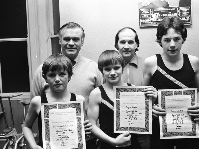 Boxers from the Ring ABC, Lawrence Hill, who were winners at the Derry and District Boxing Championships. From left, Denis McGinley, 6 st. champion, Paul Burke, 7 st. champion, and Kevin Doherty, 9 st. 7 lb. champion. At back are Tommy Donnelly, trainer, and Bob Barron, club treasurer.
