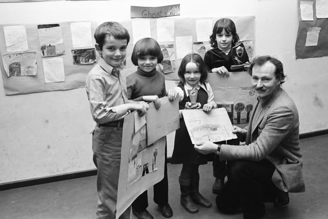 Mr. Declan McGonagle, Derry Arts Council, presents trophies and Co-Op shares to the winners of the Galliagh Co-Op painting competition. From left to right, Damien McColgan, Stephen Wright, Sinead Wright and Margaret McMonagle.