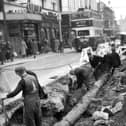 Classic cinema in Commercial Road, opposite Arundel Street junction and the lowering a 10-inch main pipe by Portsmouth Water Company in the foreground.