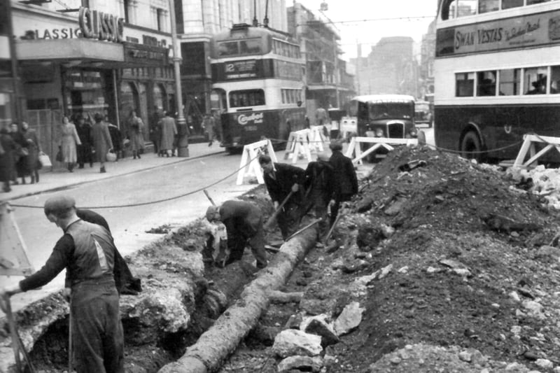 Classic cinema in Commercial Road, opposite Arundel Street junction and the lowering a 10-inch main pipe by Portsmouth Water Company in the foreground.