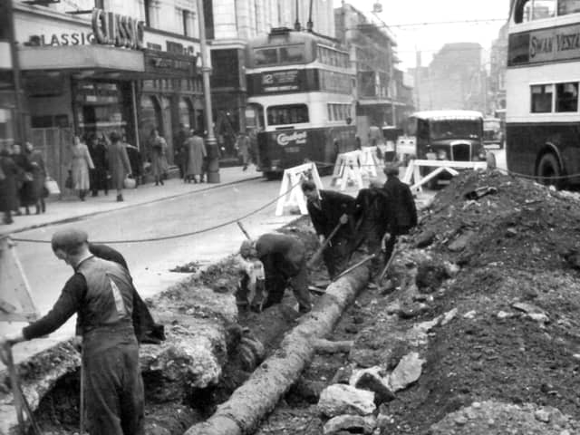 Classic cinema in Commercial Road, opposite Arundel Street junction and the lowering a 10-inch main pipe by Portsmouth Water Company in the foreground.