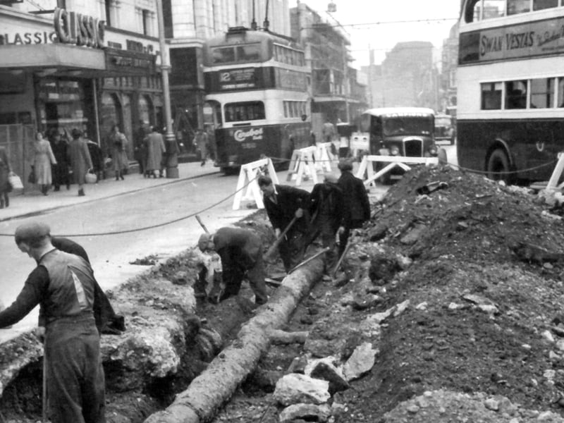 Classic cinema in Commercial Road, opposite Arundel Street junction and the lowering a 10-inch main pipe by Portsmouth Water Company in the foreground.