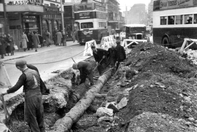 Classic cinema in Commercial Road, opposite Arundel Street junction and the lowering a 10-inch main pipe by Portsmouth Water Company in the foreground.