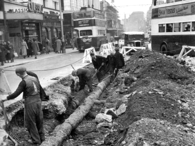 Classic cinema in Commercial Road, opposite Arundel Street junction and the lowering a 10-inch main pipe by Portsmouth Water Company in the foreground.