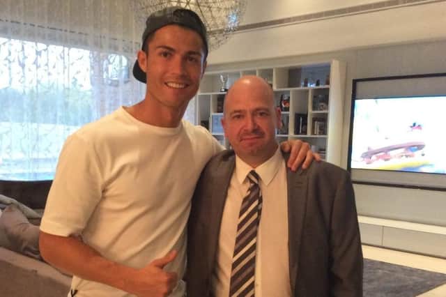 Portsmouth celebrity selfies: Glyn Tookey, 52 from Stubbington, pictured right, with Portuguese football superstar Cristiano Ronaldo at his former home in La Finca, Spain.