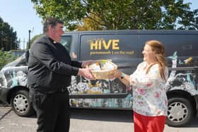 The launch of the Harvest Appeal, encouraging people to donate food tins.

Pictured is: Father Bob White with Fratton residentMaggie Moles.

Picture: Sarah Standing (140920-3998)