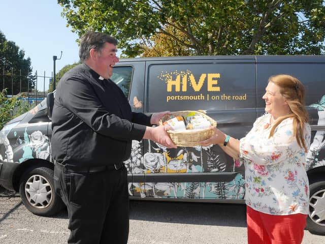 The launch of the Harvest Appeal, encouraging people to donate food tins.

Pictured is: Father Bob White with Fratton residentMaggie Moles.

Picture: Sarah Standing (140920-3998)