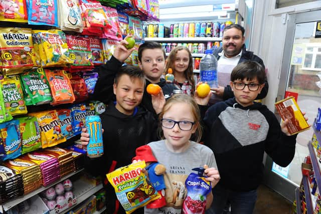 Isambard Brunel Junior School children at The Sweetland Convenience Store who agreed not to sell sugary sweets and drinks before school.
Picture: Sarah Standing