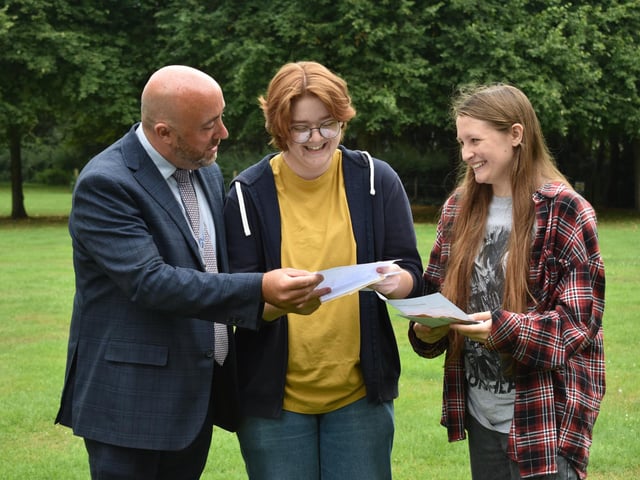 Exec head Chris Willis with Emily Slight and Lizzie Wood at Bay House on GCSE results day