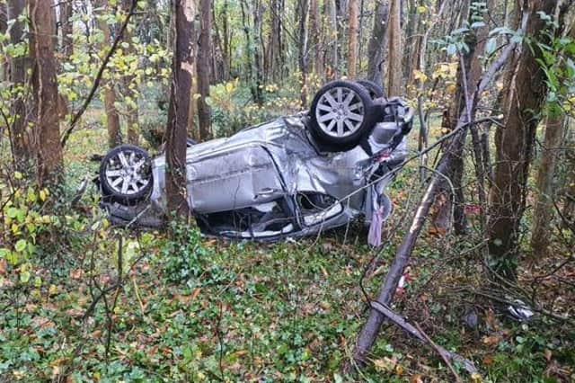Hampshire Response team were called to the A32 between Fareham and Knowle after a car flipped on its roof into the woods. Picture: Hants Response Cops